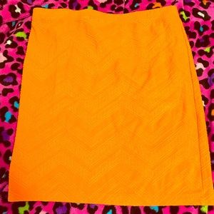 A Bright Orange Mini Skirt